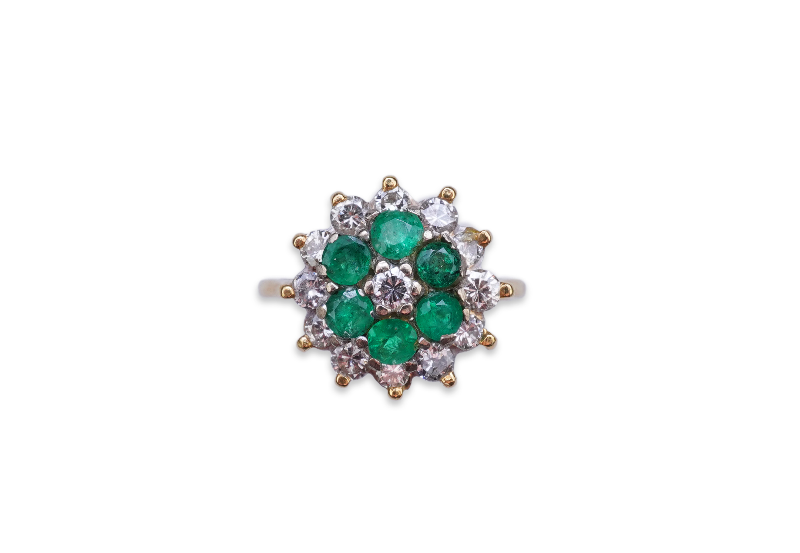 An emerald and diamond ring
